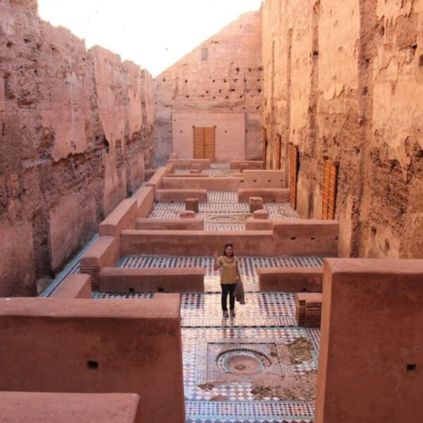 A woman inside the Badi palace in Marrakech, an attraction during the 10-day Morocco tour from Casablanca.