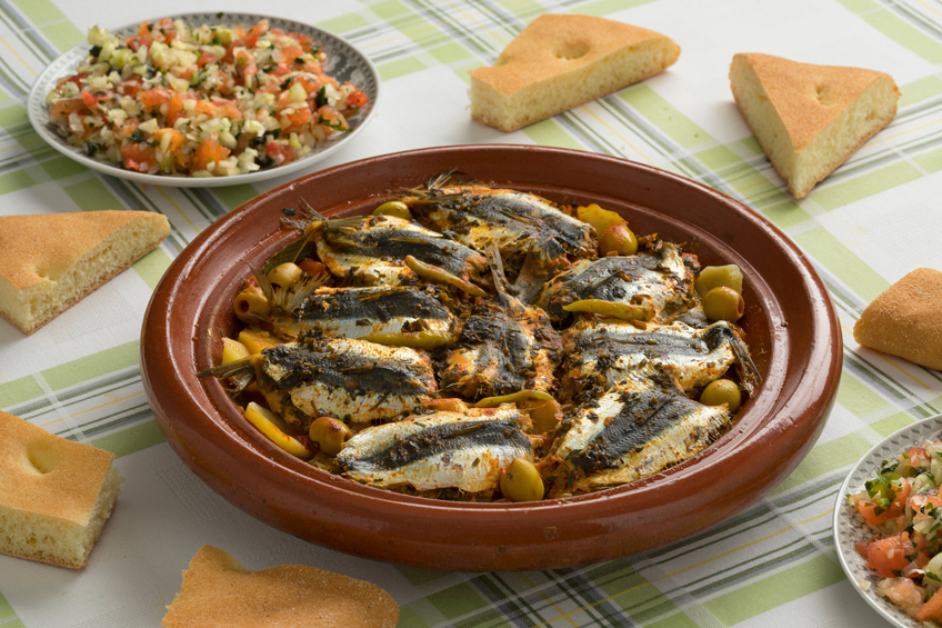 Moroccan sardines on a table with other salads