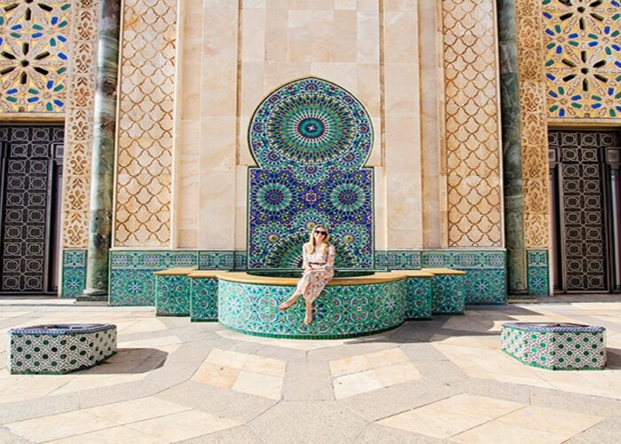 A woman in the courtyard of Hassan 2 mosque during the 3-Day Tour From Fes To Casablanca.