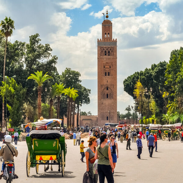 Tourists having a walk in Jamaa El Fna Square in Marrakech.