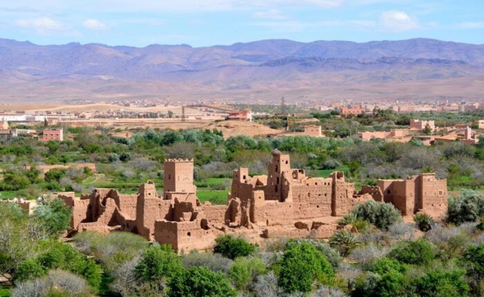 A collapsed house in the middle of a valley in Morocco during the 4-Day Tour From Agadir To Merzouga Desert.