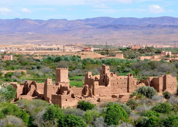 A collapsed house in the middle of a valley in Morocco during the 4-Day Tour From Agadir To Merzouga Desert.