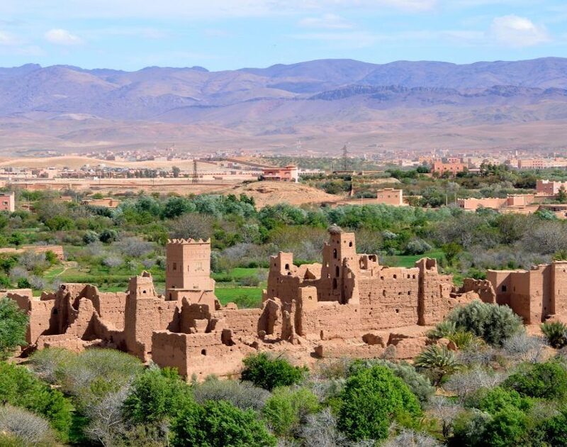 A collapsed house in the middle of a valley in Morocco during the 4-Day Tour From Agadir To Merzouga Desert.