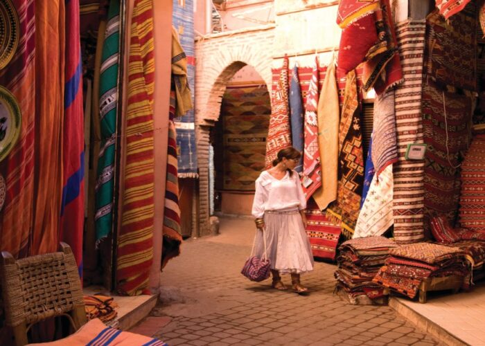 Medina of Marrakech and a woman looking to buy carpets